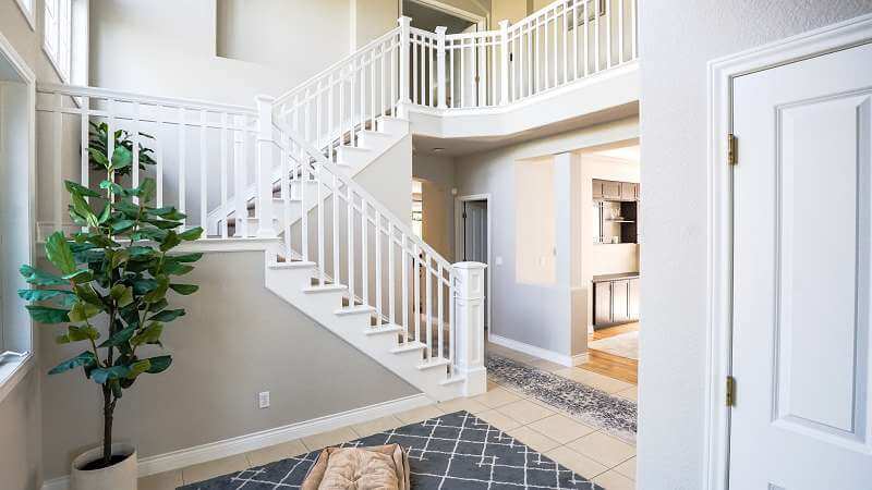 Entryway and stair railing interior painting
